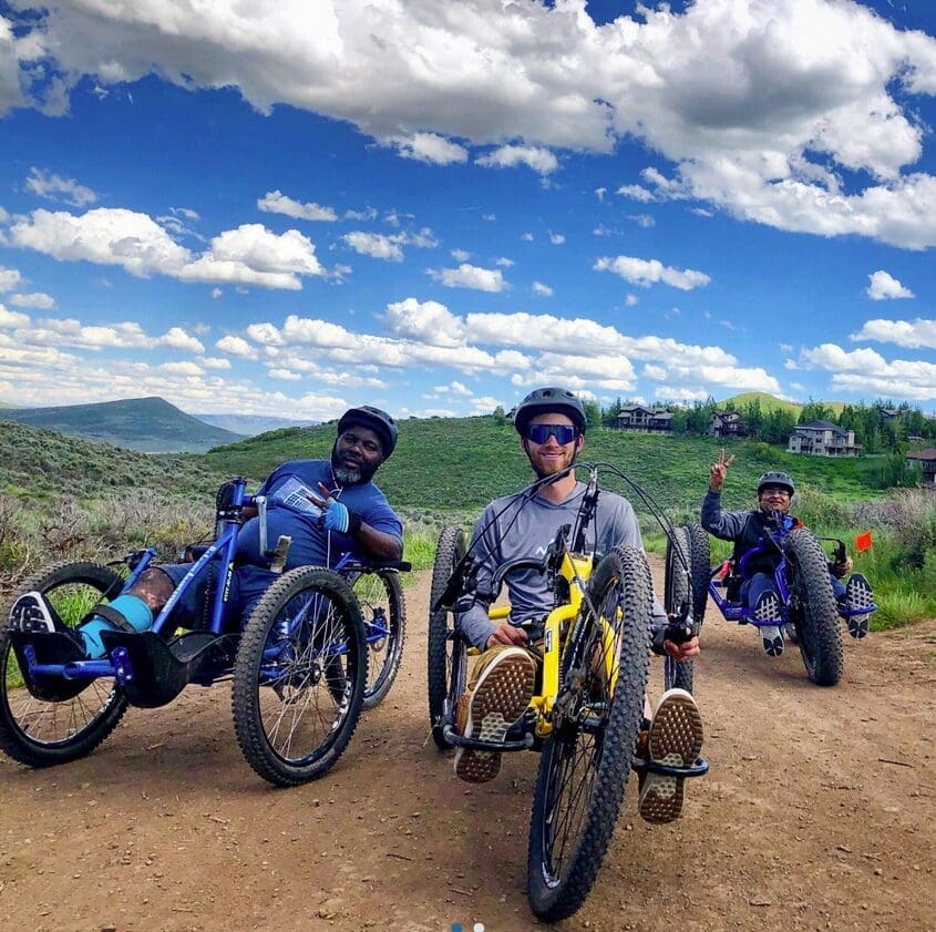 Adaptive riders on Big Water Trail to Dog Lake